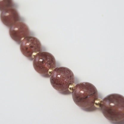 MXW Jewellery Red strawberry quartz beaded necklace with a gold bubble initial pendant.