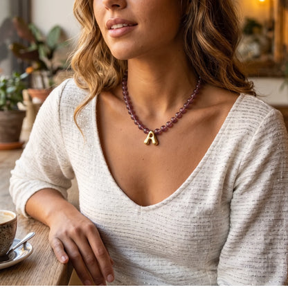 MXW Jewellery Red strawberry quartz beaded necklace with a gold bubble initial pendant.