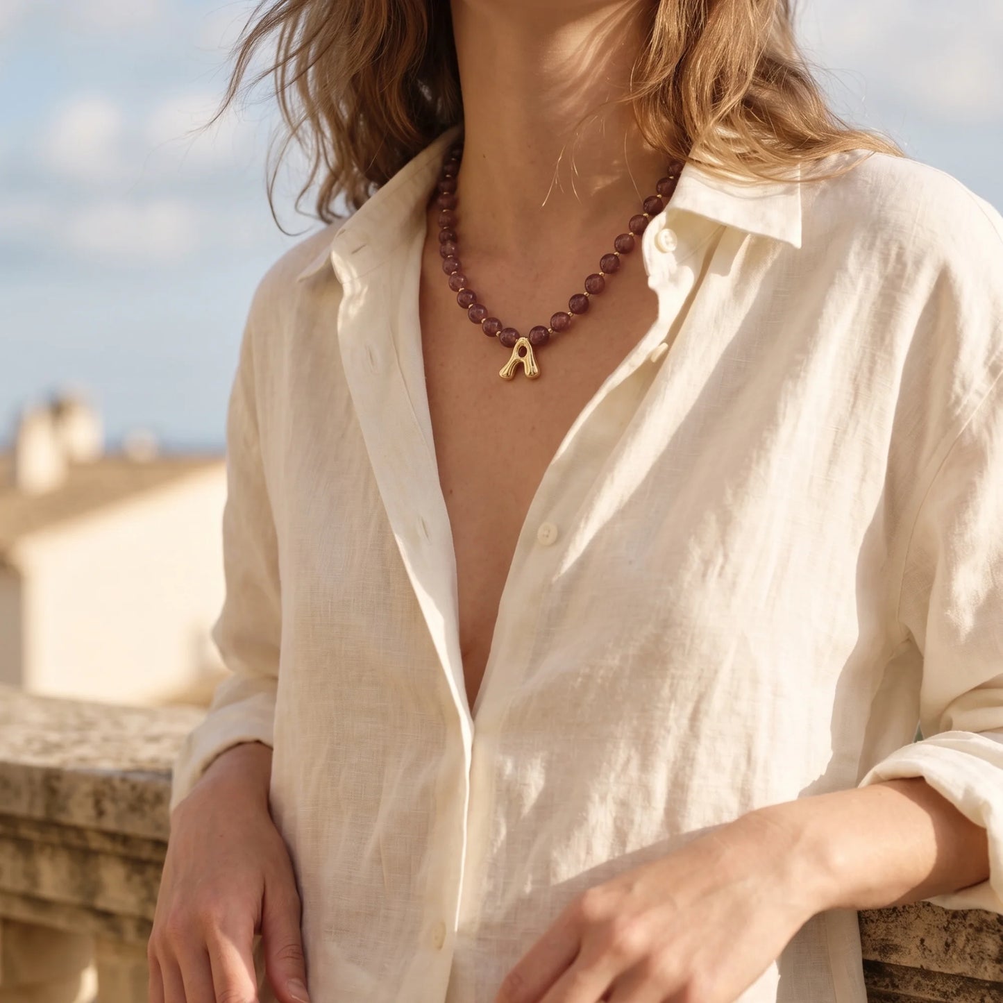 MXW Jewellery Red strawberry quartz beaded necklace with a gold bubble initial pendant.