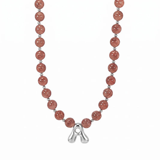 MXW Jewellery Red strawberry quartz beaded necklace with a silver bubble initial pendant.