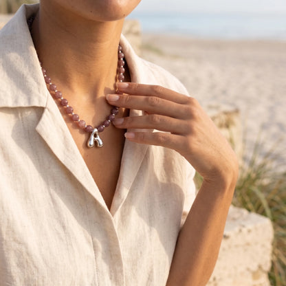 MXW Jewellery Red strawberry quartz beaded necklace with a silver bubble initial pendant.