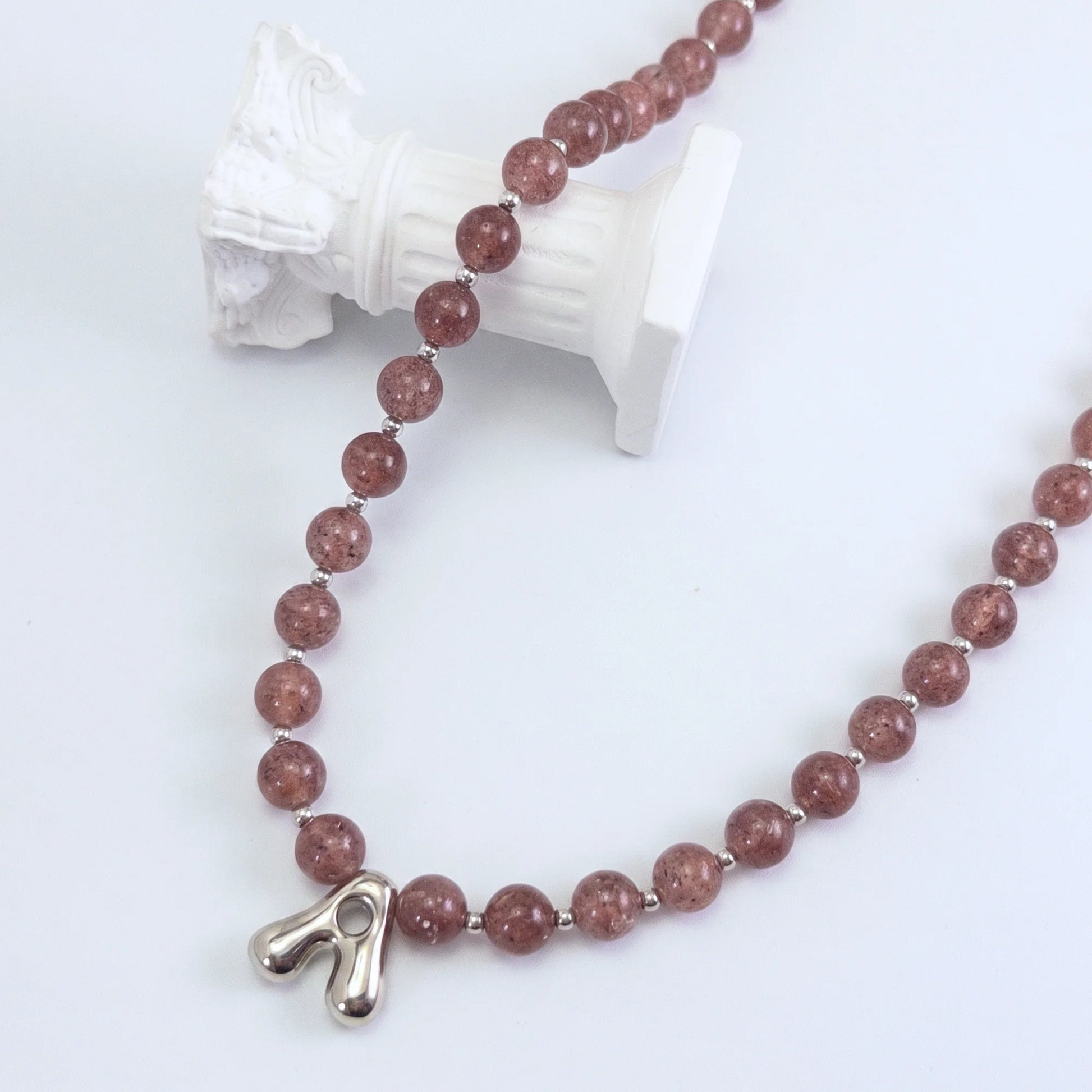 MXW Jewellery Red strawberry quartz beaded necklace with a silver bubble initial pendant.