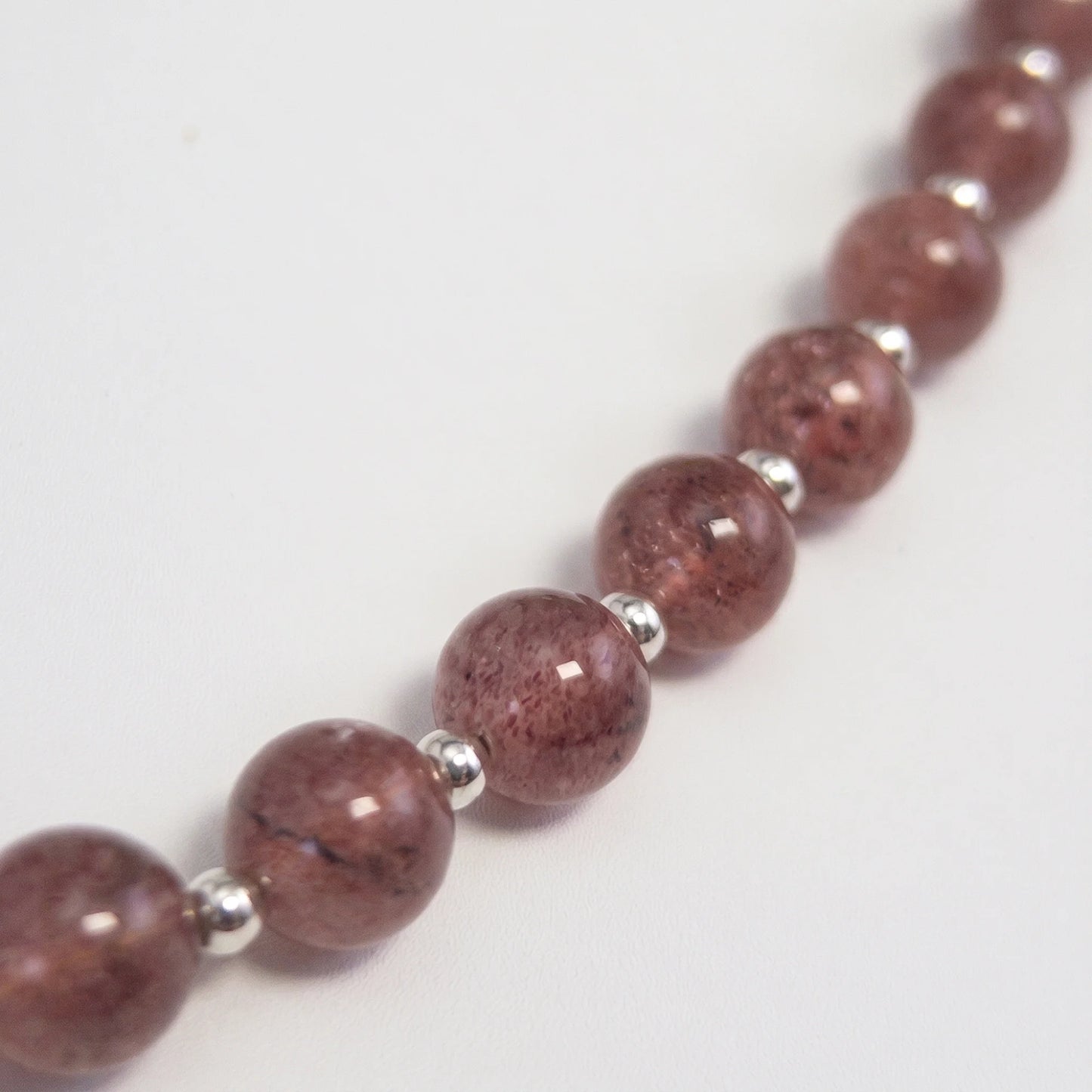 MXW Jewellery Red strawberry quartz beaded necklace with a silver bubble initial pendant.