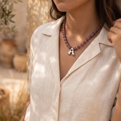 MXW Jewellery Red strawberry quartz beaded necklace with a silver bubble initial pendant.