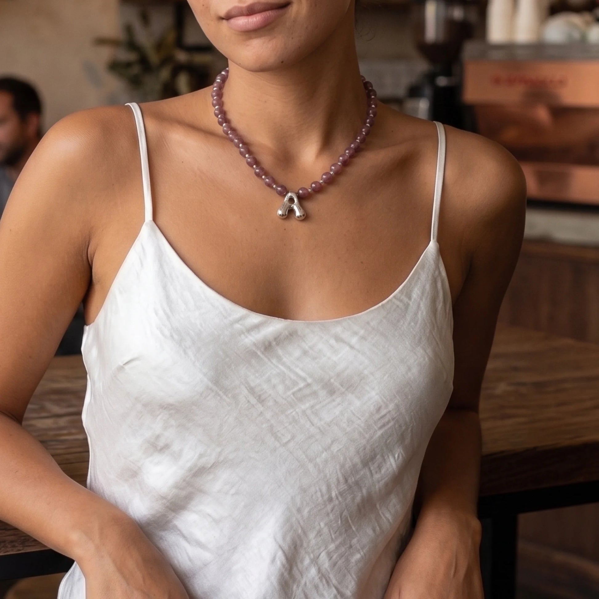 MXW Jewellery Red strawberry quartz beaded necklace with a silver bubble initial pendant.