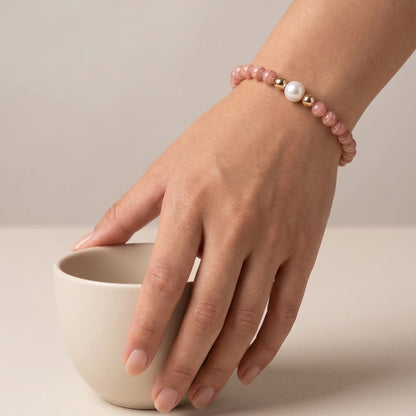 Rhodochrosite, pearl and initial gold bracelet featuring natural pink gemstone beads, lustrous freshwater pearls and a personalised gold-filled stamped initial disc.