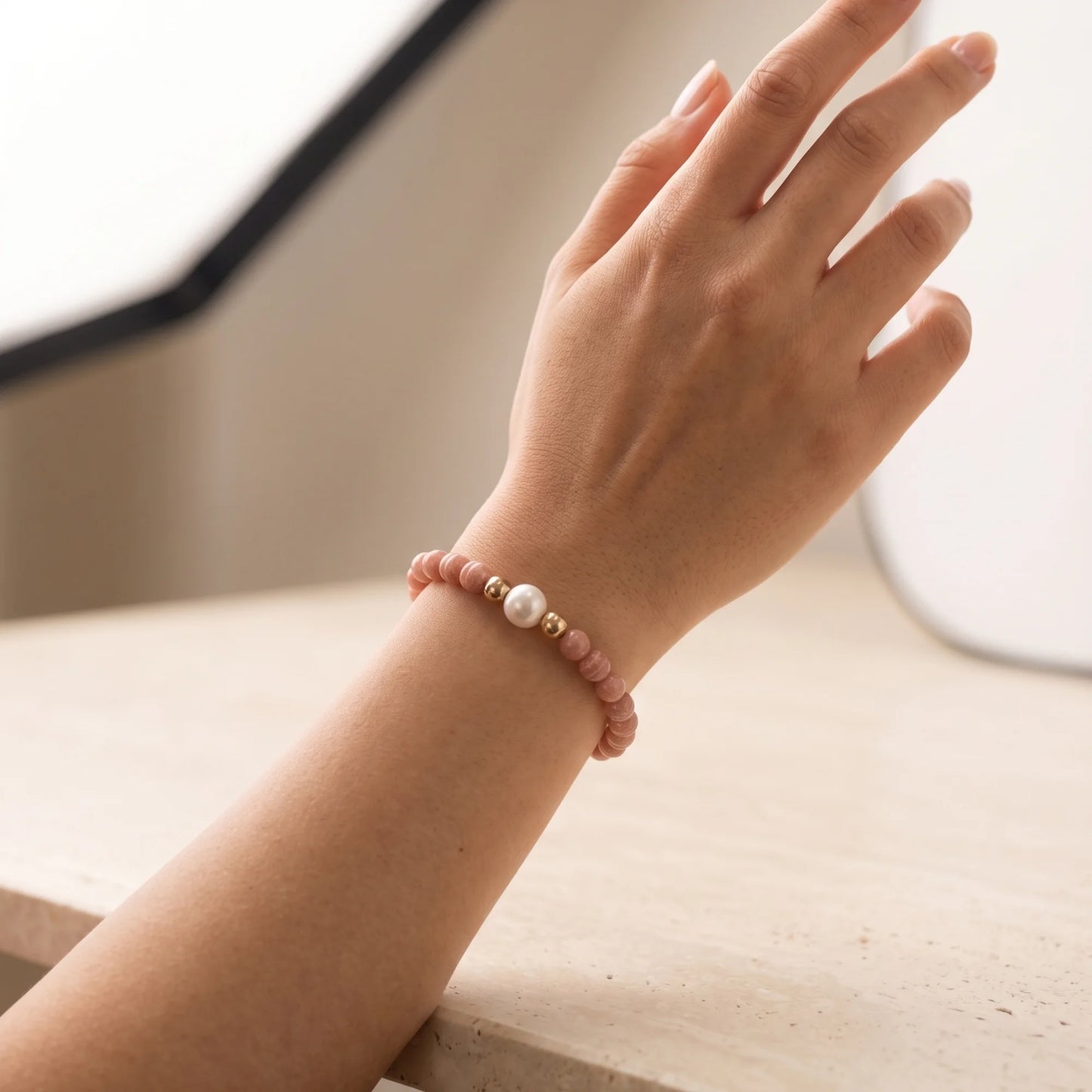 Rhodochrosite, pearl and initial gold bracelet featuring natural pink gemstone beads, lustrous freshwater pearls and a personalised gold-filled stamped initial disc.