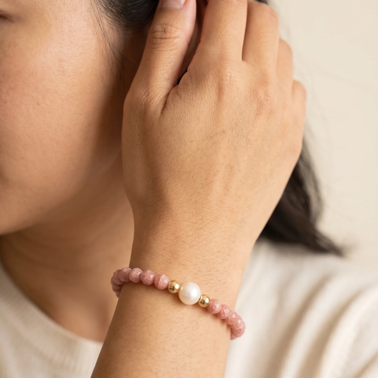 Rhodochrosite, pearl and initial gold bracelet featuring natural pink gemstone beads, lustrous freshwater pearls and a personalised gold-filled stamped initial disc.