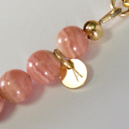 Rhodochrosite, pearl and initial gold bracelet featuring natural pink gemstone beads, lustrous freshwater pearls and a personalised gold-filled stamped initial disc.