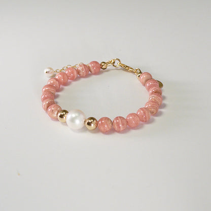 Rhodochrosite, pearl and initial gold bracelet featuring natural pink gemstone beads, lustrous freshwater pearls and a personalised gold-filled stamped initial disc.
