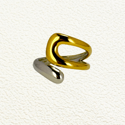 Sculpted Arc Ring in gold and silver, featuring a curved open-band design with smooth, reflective finish. Waterproof and hypoallergenic, worn as a modern statement ring.