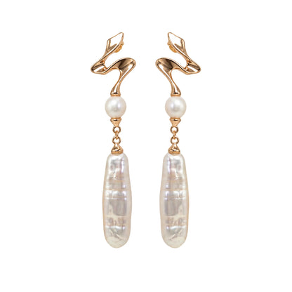 MXW gold vermeil drop earrings with a sculpted wave stud, a round freshwater pearl and a long baroque pearl drop.