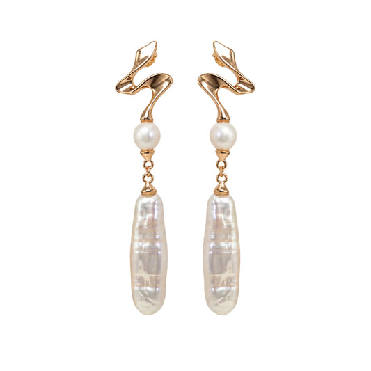 MXW gold vermeil drop earrings with a sculpted wave stud, a round freshwater pearl and a long baroque pearl drop.