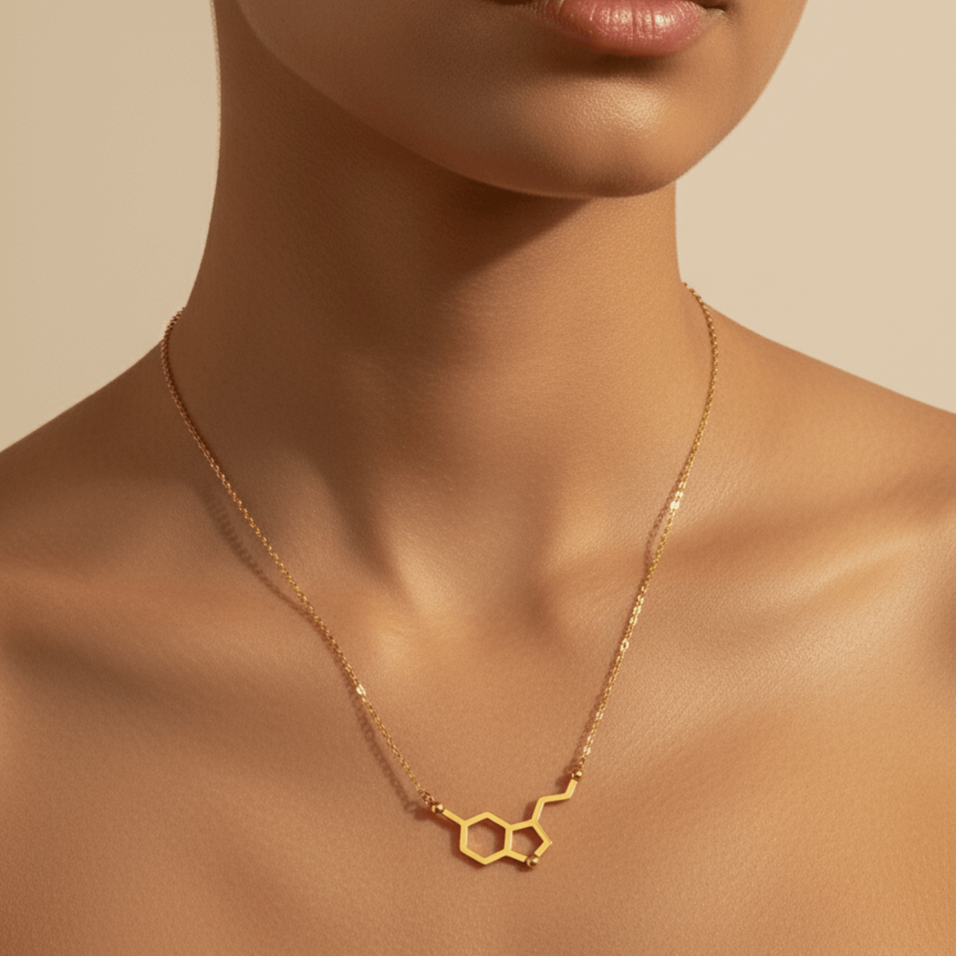 Gold serotonin molecule necklace on a fine chain, minimal jewellery
