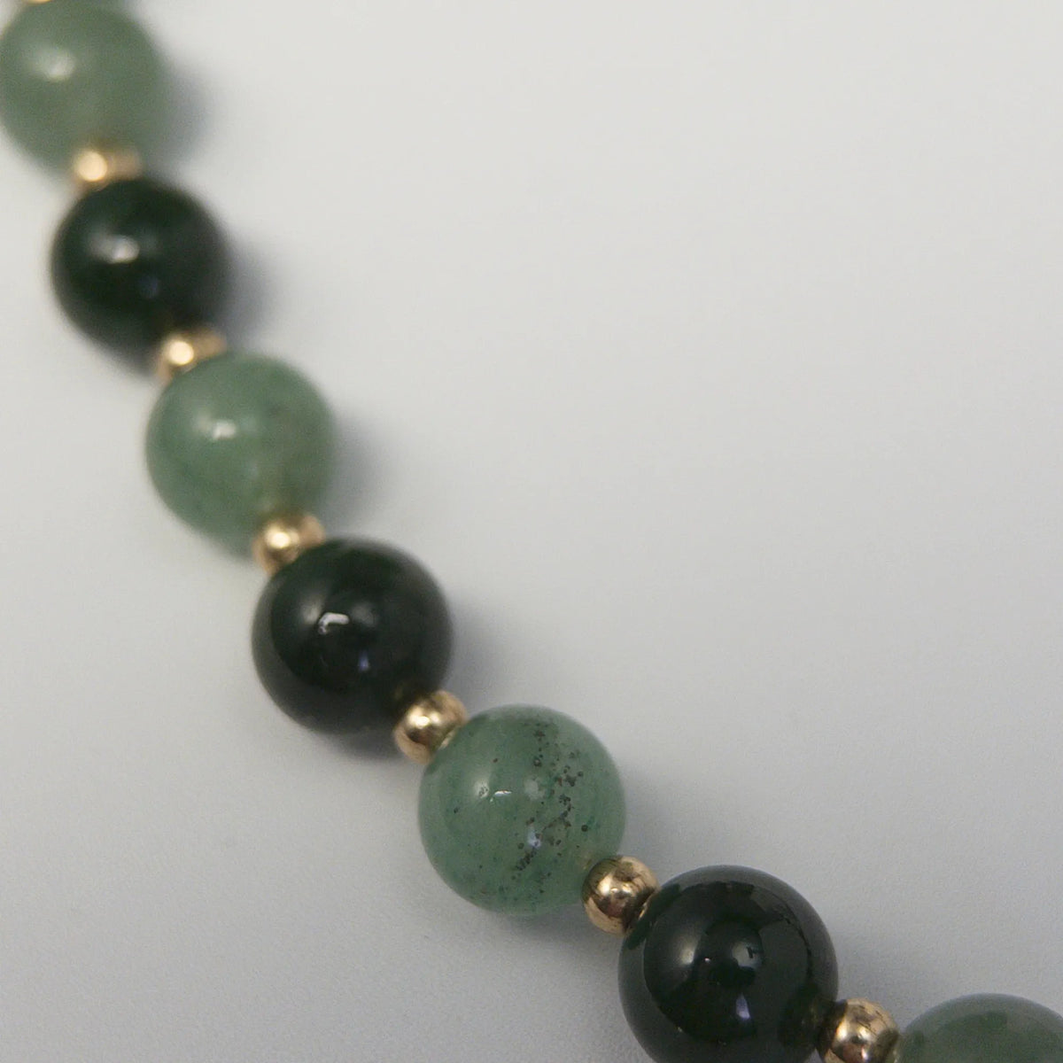 14K gold filled initial necklace with alternating nephrite jade and green aventurine beads and a bubble letter pendant