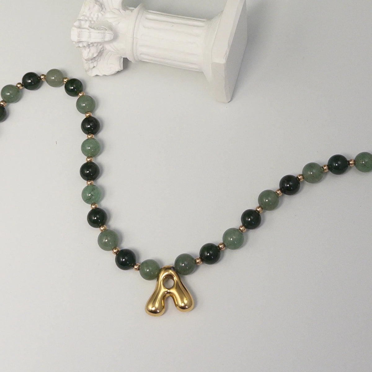 14K gold filled initial necklace with alternating nephrite jade and green aventurine beads and a bubble letter pendant