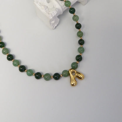 14K gold filled initial necklace with alternating nephrite jade and green aventurine beads and a bubble letter pendant