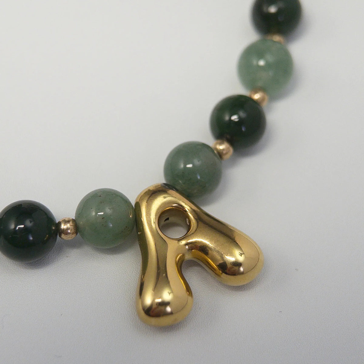 14K gold filled initial necklace with alternating nephrite jade and green aventurine beads and a bubble letter pendant