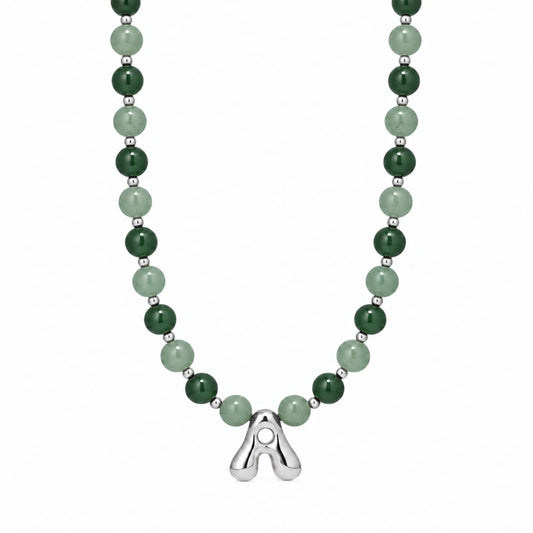 sterling silver necklace with alternating nephrite jade and green aventurine beads and a bubble letter pendant.