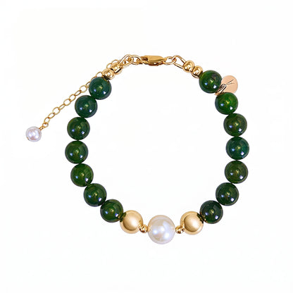 Siberian nephrite jade, pearl and initial bracelet featuring deep green gemstone beads, lustrous freshwater pearls and a personalised stamped 14K gold-filled initial disc.