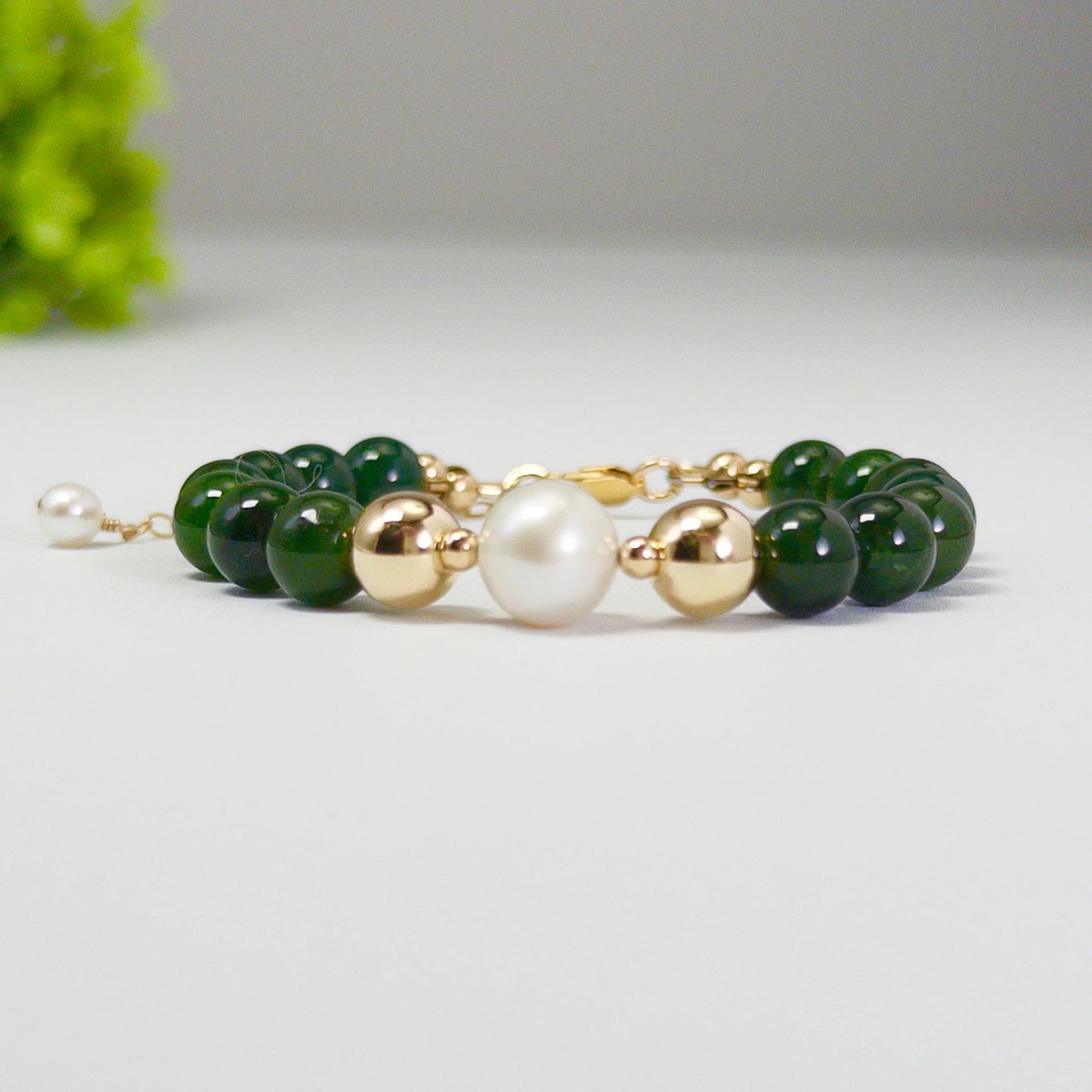 Siberian nephrite jade, pearl and initial bracelet featuring deep green gemstone beads, lustrous freshwater pearls and a personalised stamped 14K gold-filled initial disc.