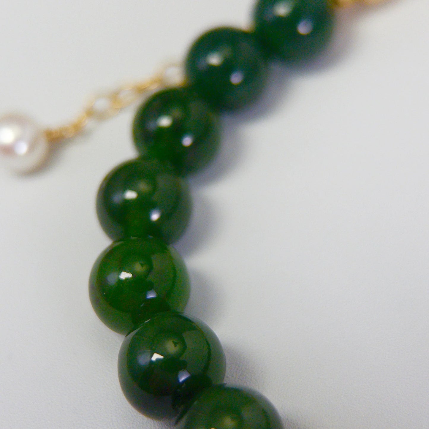 Siberian nephrite jade, pearl and initial bracelet featuring deep green gemstone beads, lustrous freshwater pearls and a personalised stamped 14K gold-filled initial disc.