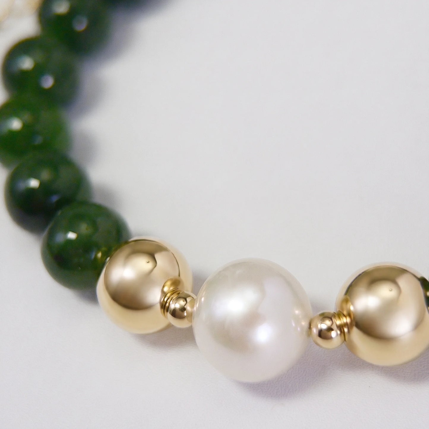 Siberian nephrite jade, pearl and initial bracelet featuring deep green gemstone beads, lustrous freshwater pearls and a personalised stamped 14K gold-filled initial disc.