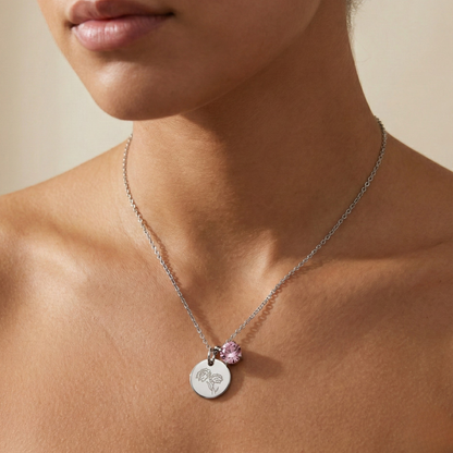 silver birth month necklace with blue crystal and engraved flower pendant