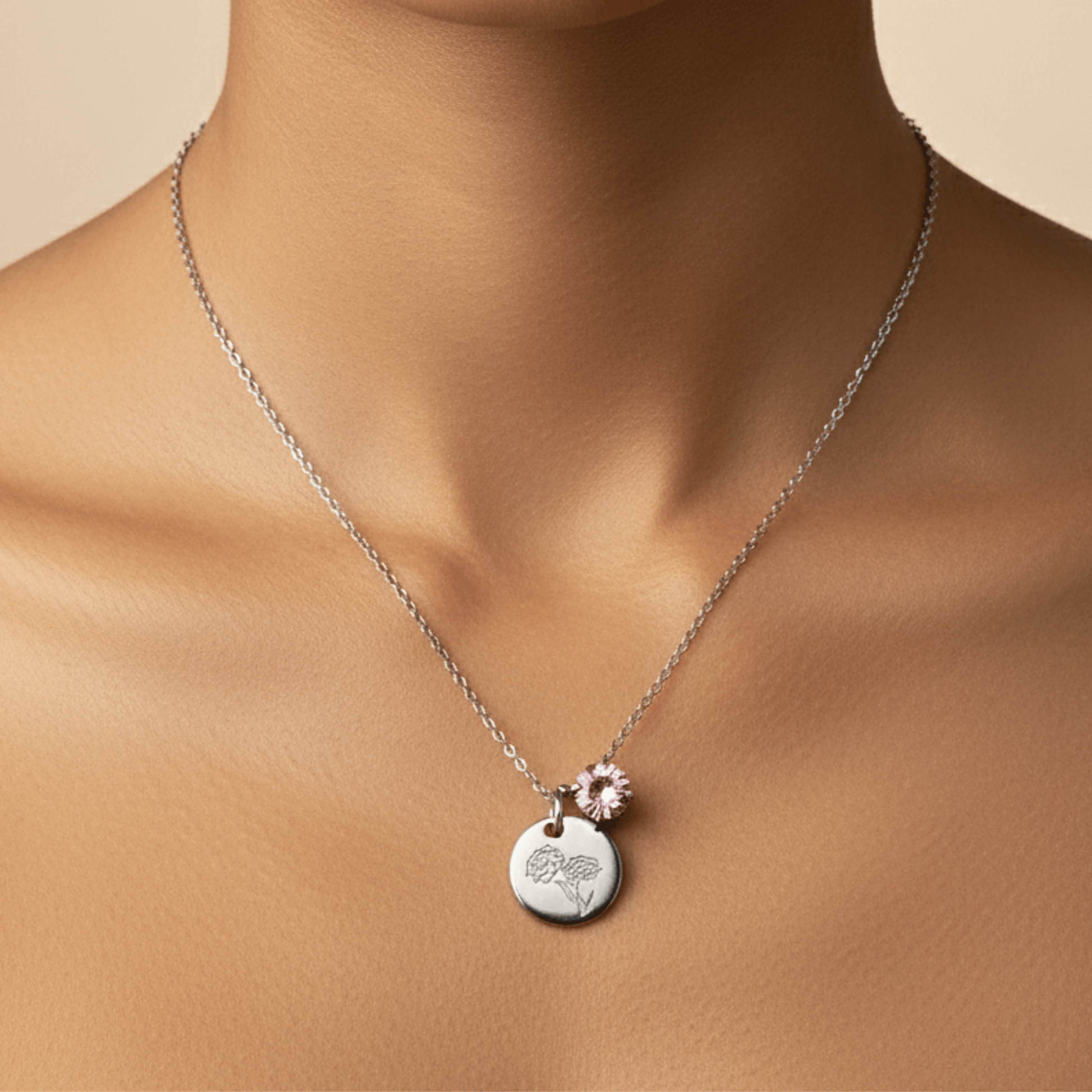 silver birth month necklace with blue crystal and engraved flower pendant