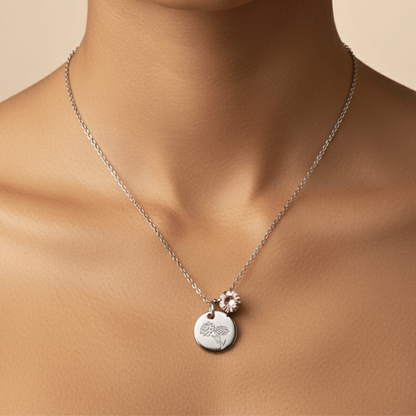 silver birth month necklace with blue crystal and engraved flower pendant