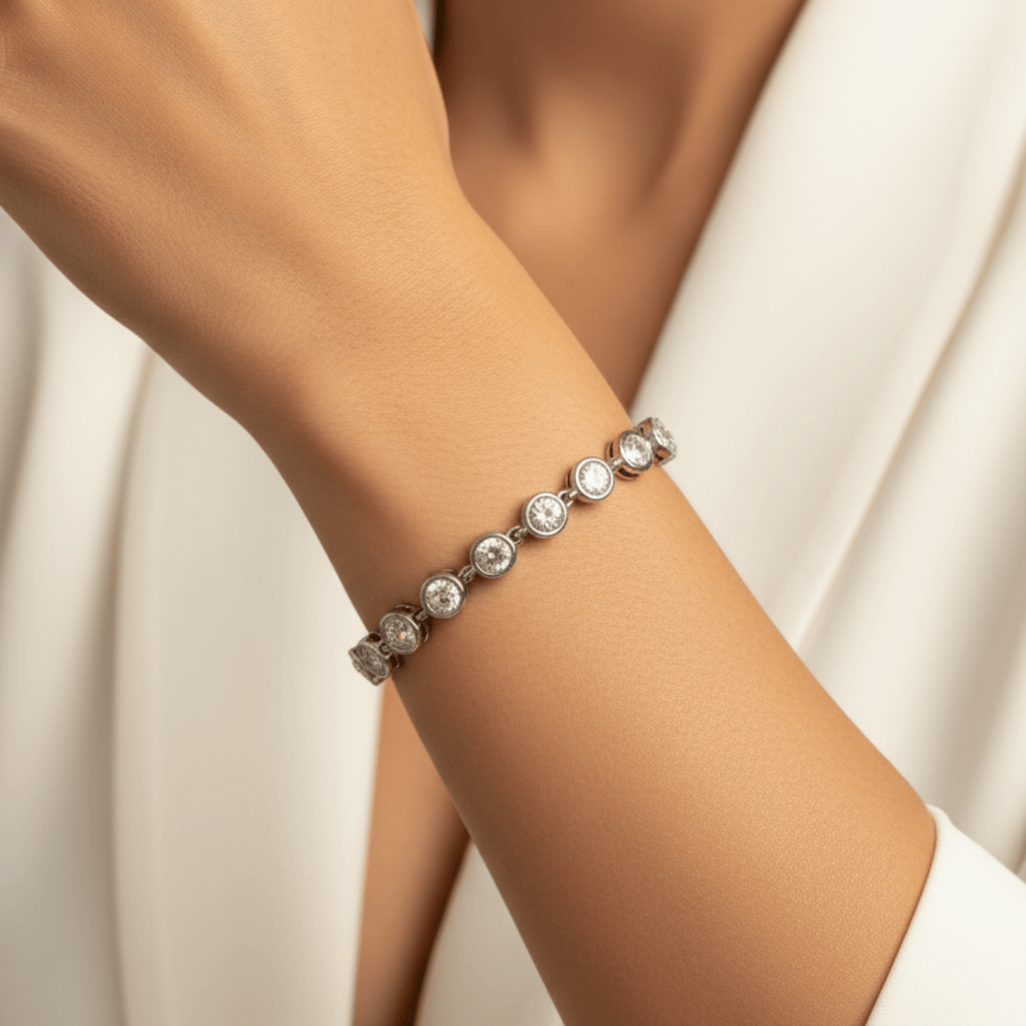 crystal tennis bracelet with bezel-set clear stones.