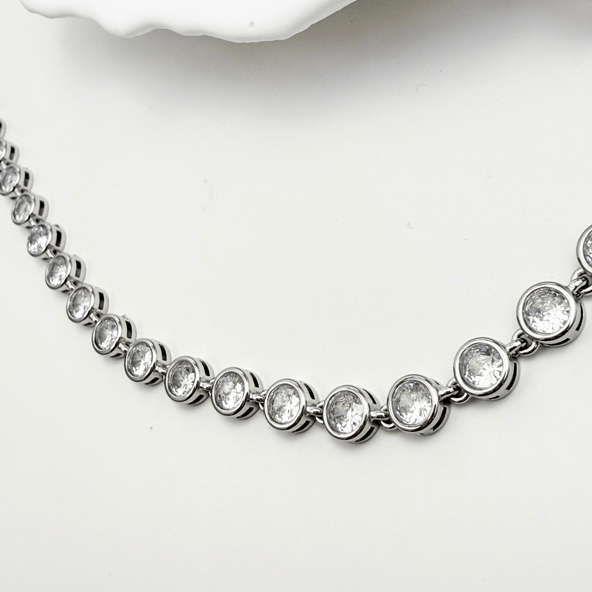 Silver crystal tennis necklace with bezel-set stones