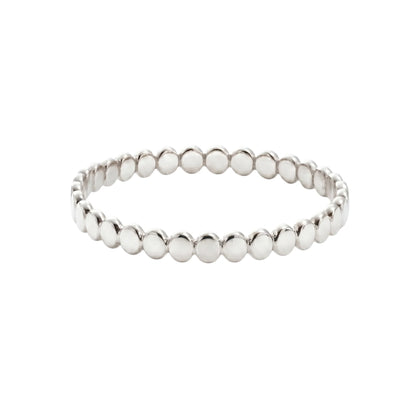 Dainty sterling silver stacking ring with small light-catching disc details