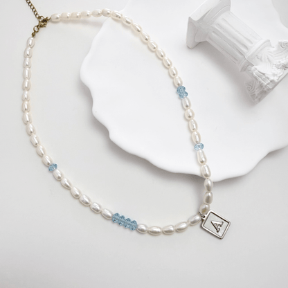 silver initial and birthstone pearl necklace featuring freshwater pearl and Swarovski element crystal, personalised elegant jewellery gift for women