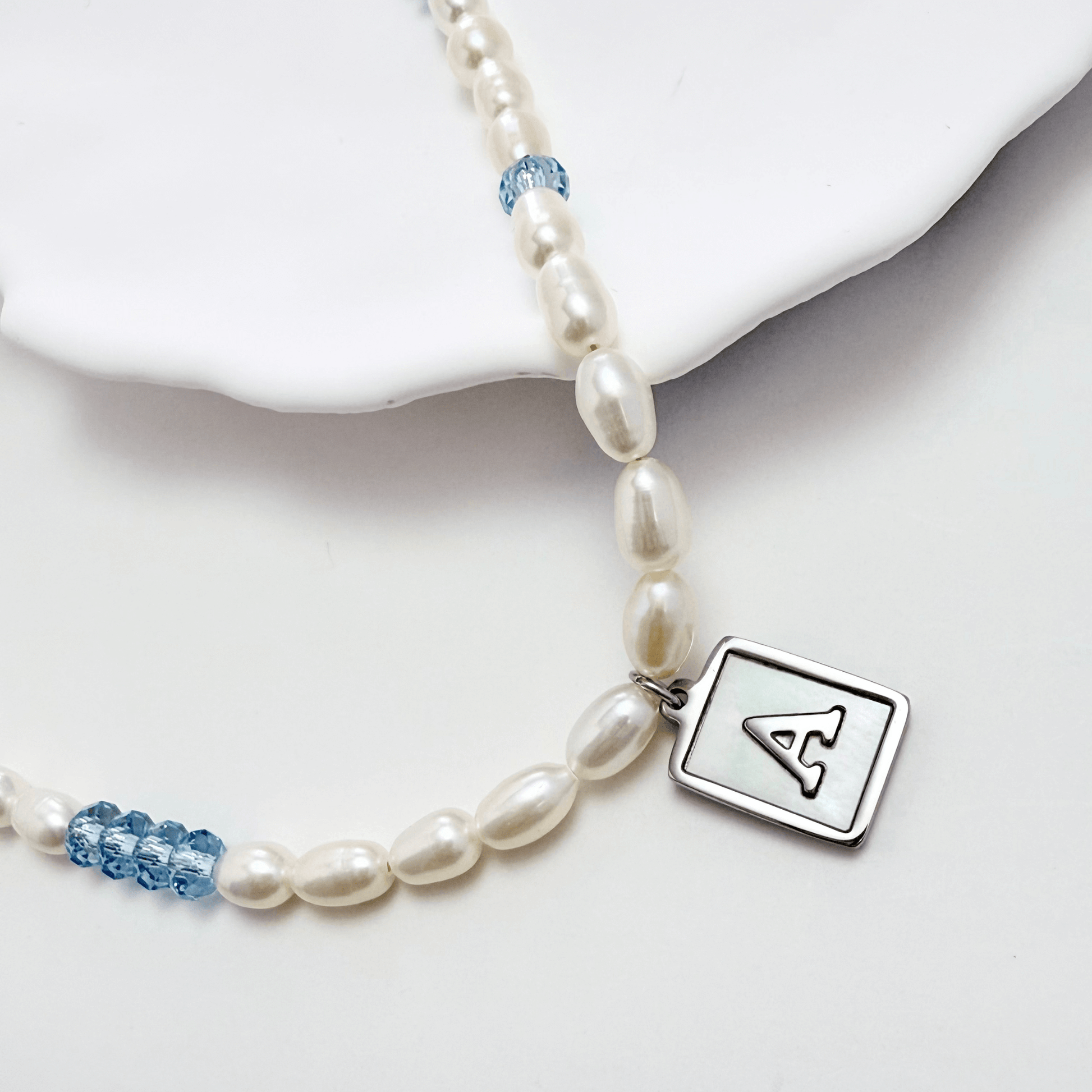 silver initial and birthstone pearl necklace featuring freshwater pearl and Swarovski element crystal, personalised elegant jewellery gift for women