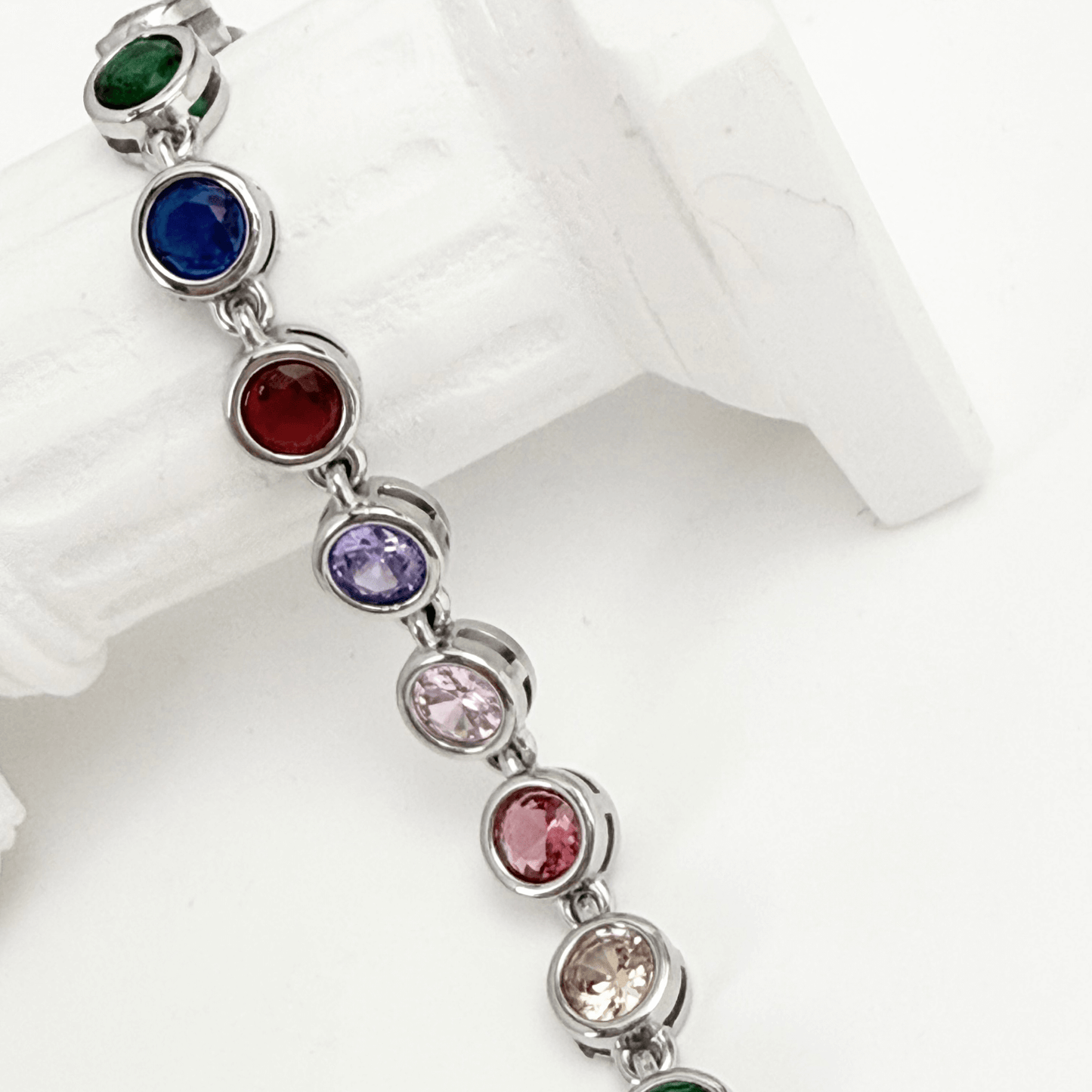 silver rainbow crystal tennis bracelet with multi-coloured bezel-set stones.