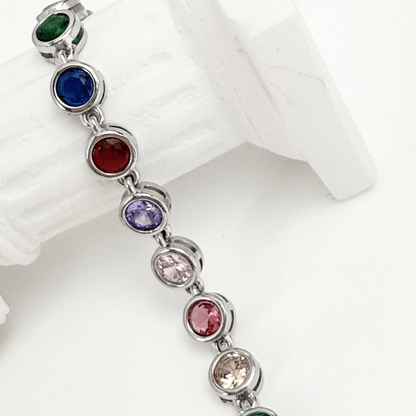 silver rainbow crystal tennis bracelet with multi-coloured bezel-set stones.
