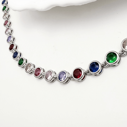 silver rainbow crystal tennis bracelet with multi-coloured bezel-set stones.