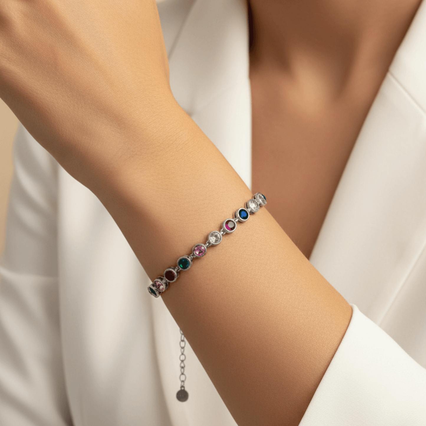 silver rainbow crystal tennis bracelet with multi-coloured bezel-set stones.