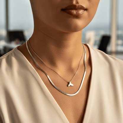Silver whale tail pendant necklace representing freedom and ocean grace.