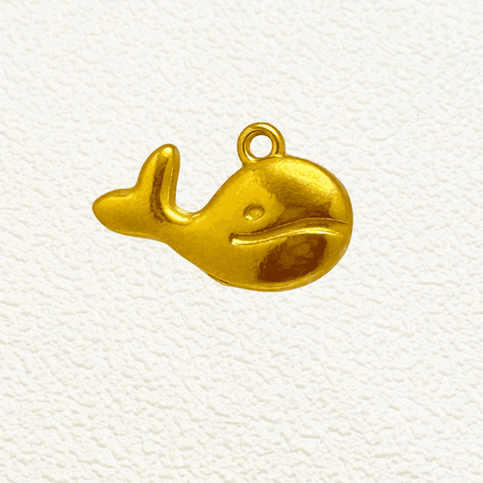 Gold whale charm with a smiling face and curved tail, PVD gold plated finish