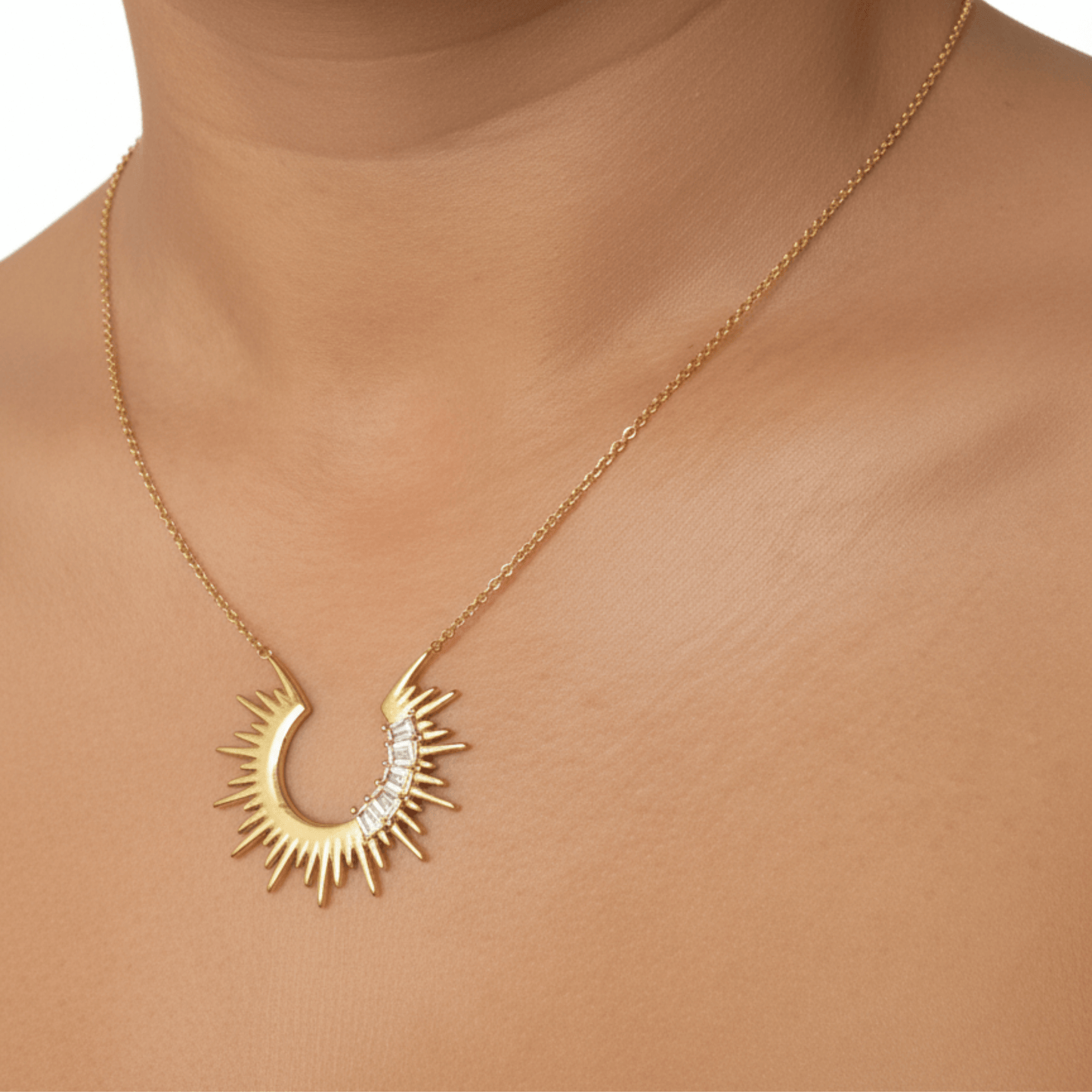 Waterproof sparkling sunburst necklace with a radiant crescent pendant in 18K PVD gold, accented with cubic zirconia