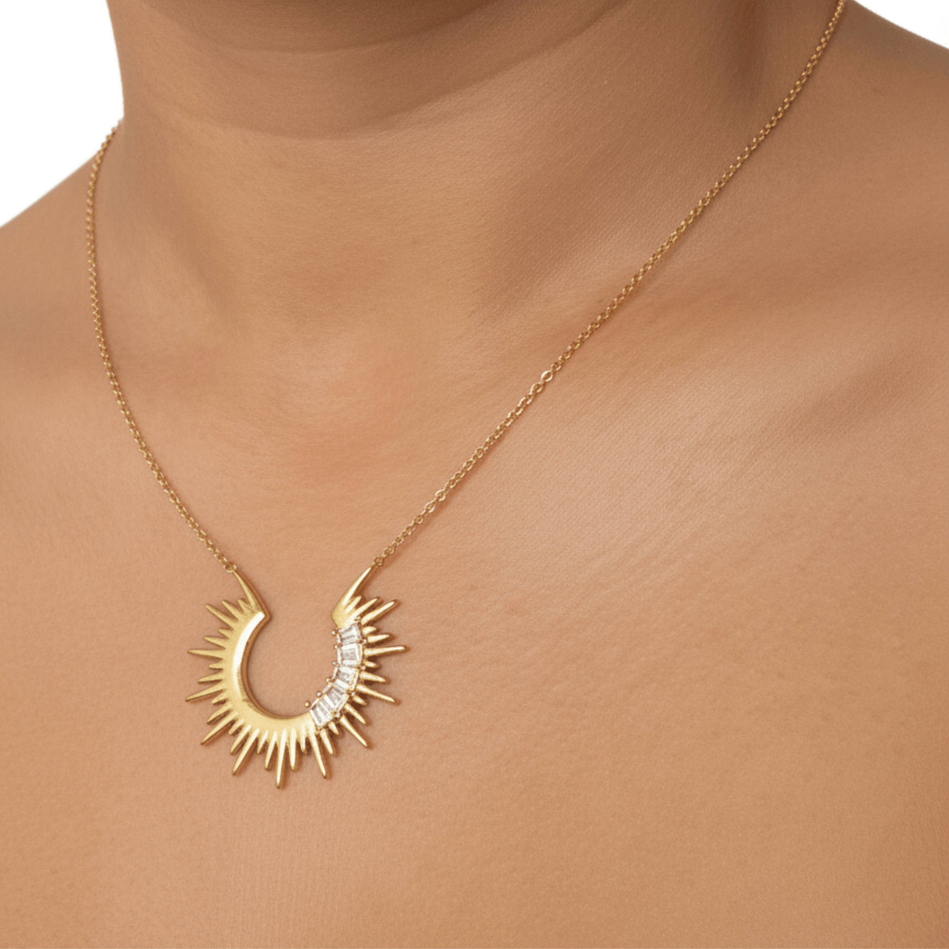 Waterproof sparkling sunburst necklace with a radiant crescent pendant in 18K PVD gold, accented with cubic zirconia