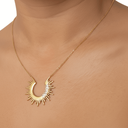 Waterproof sparkling sunburst necklace with a radiant crescent pendant in 18K PVD gold, accented with cubic zirconia
