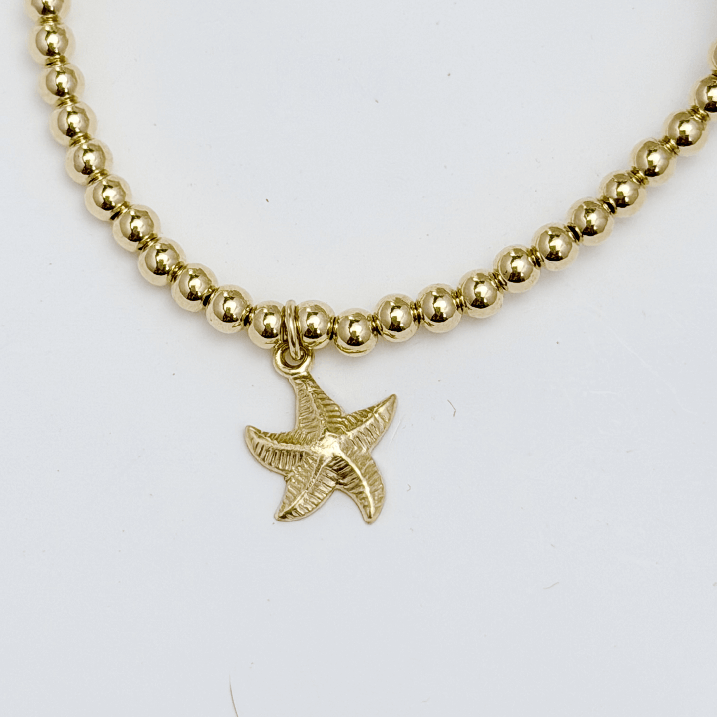 Waterproof starfish charm gold bead bracelet with textured starfish detail – MXW Jewellery