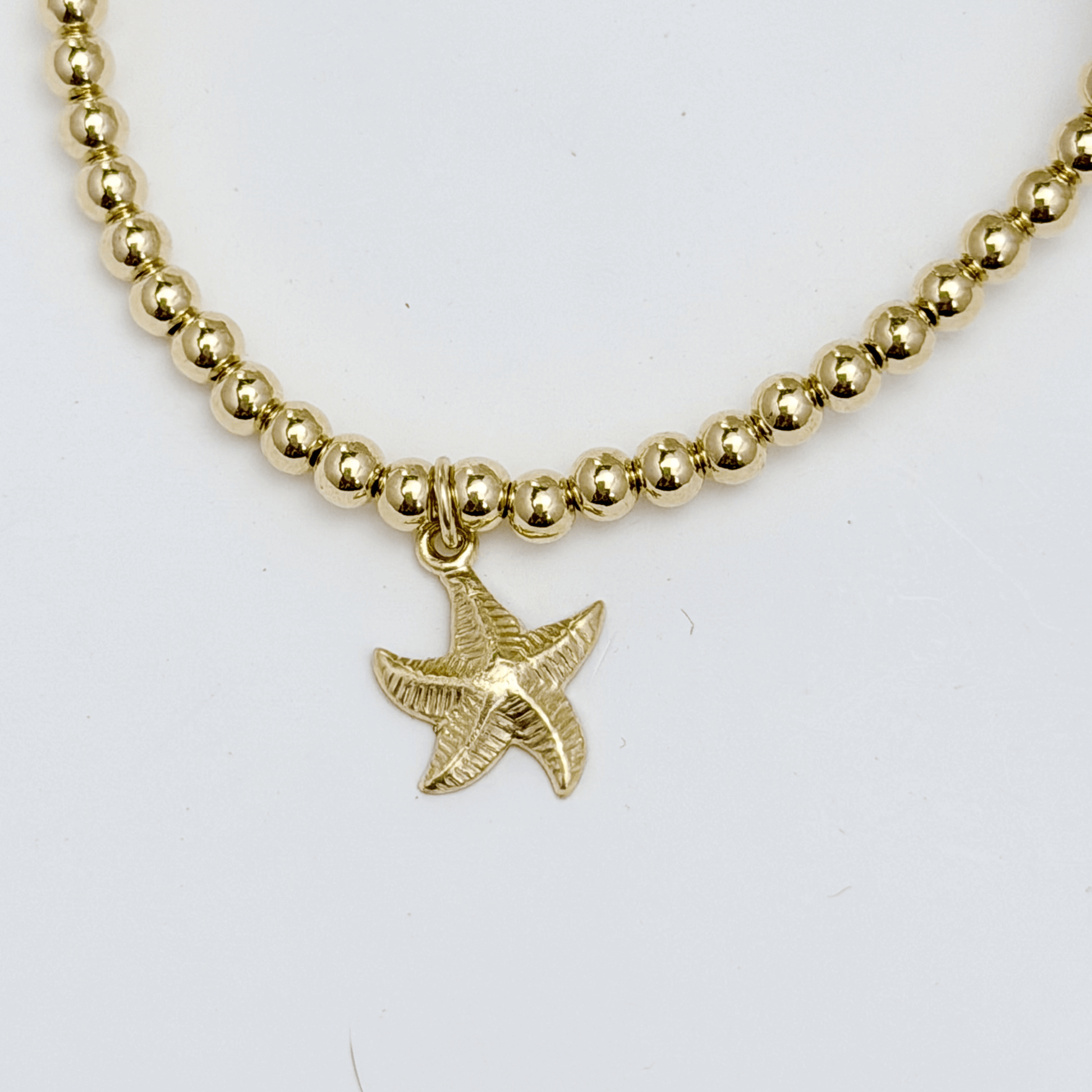 Waterproof starfish charm gold bead bracelet with textured starfish detail – MXW Jewellery
