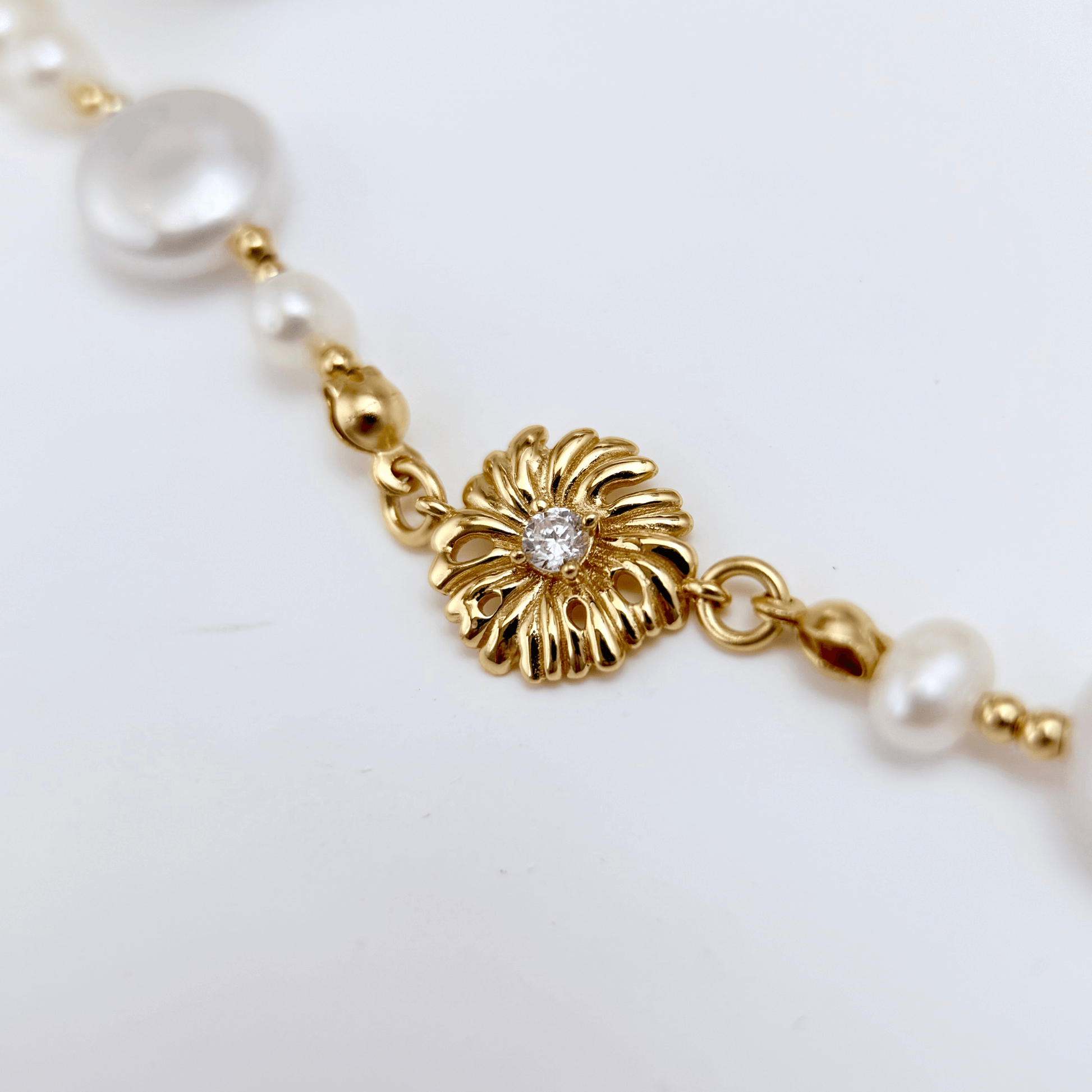 Gold and pearl sunburst necklace with baroque pearls and vintage-inspired design