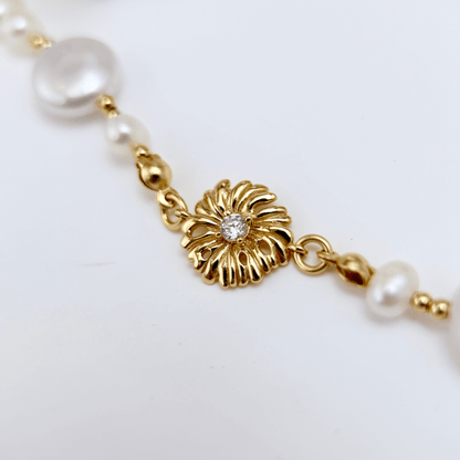 Gold and pearl sunburst necklace with baroque pearls and vintage-inspired design