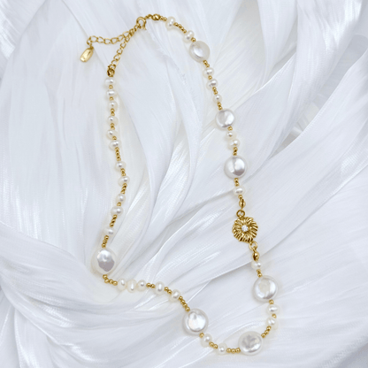 Gold and pearl sunburst necklace with baroque pearls and vintage-inspired design