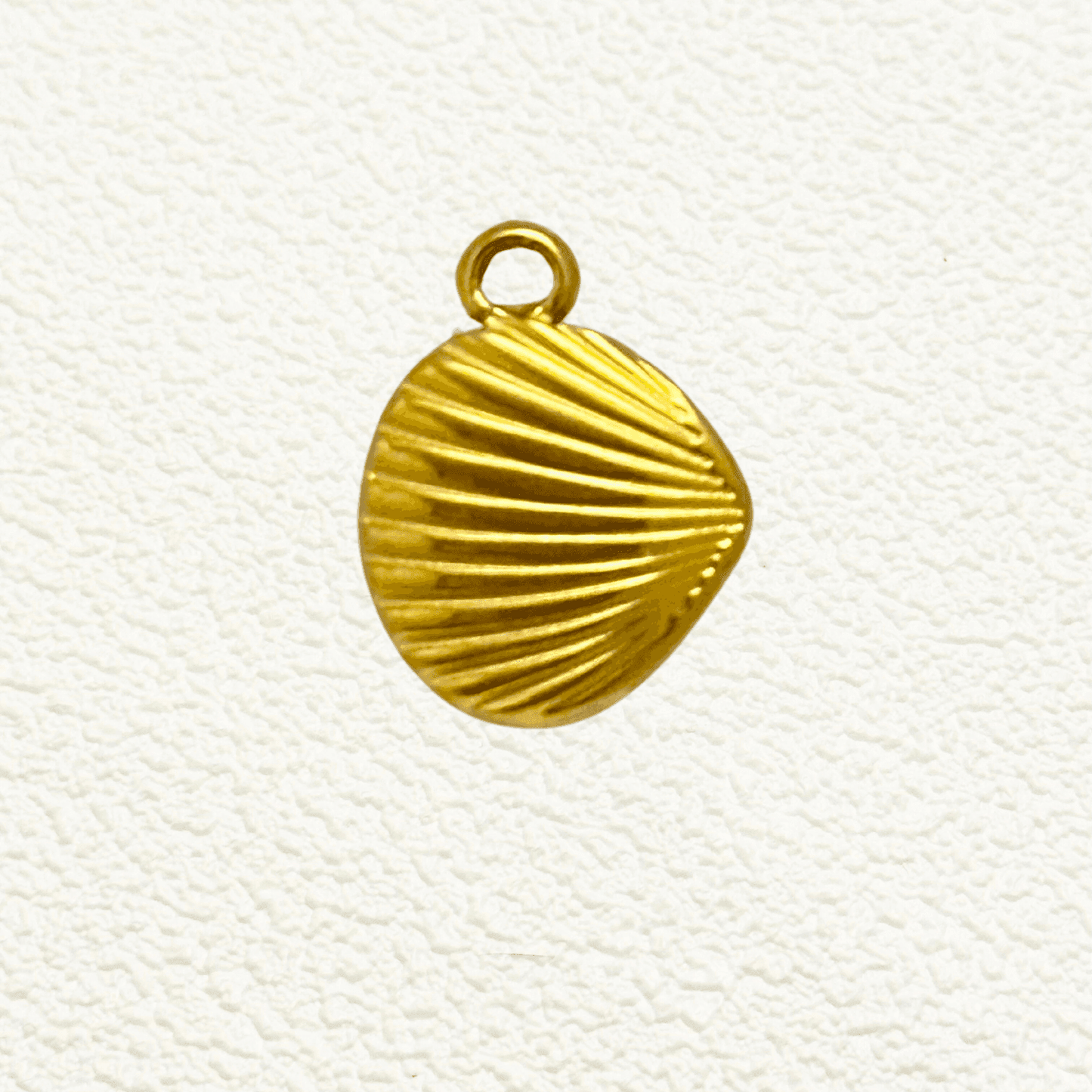 Gold clam shell charm with fine vertical ridges, PVD gold plated finish